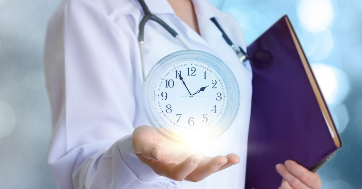 Doctor holding a clock in hand