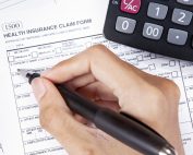Insurance claim form and a calculator