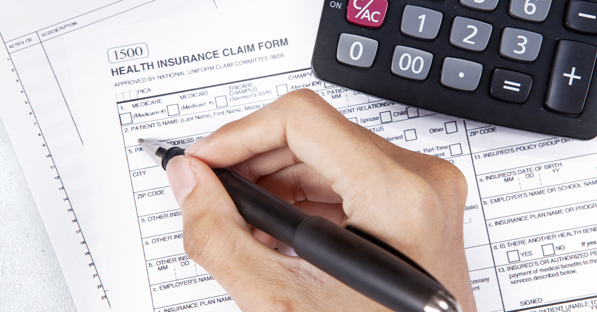 Insurance claim form and a calculator