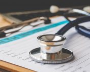 Insurance coverage form and stethoscope