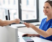 nurse collecting payment from patient