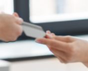 nurse collecting payment from patient